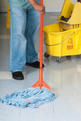KCC Cleaning Services LLC janitor mopping floor